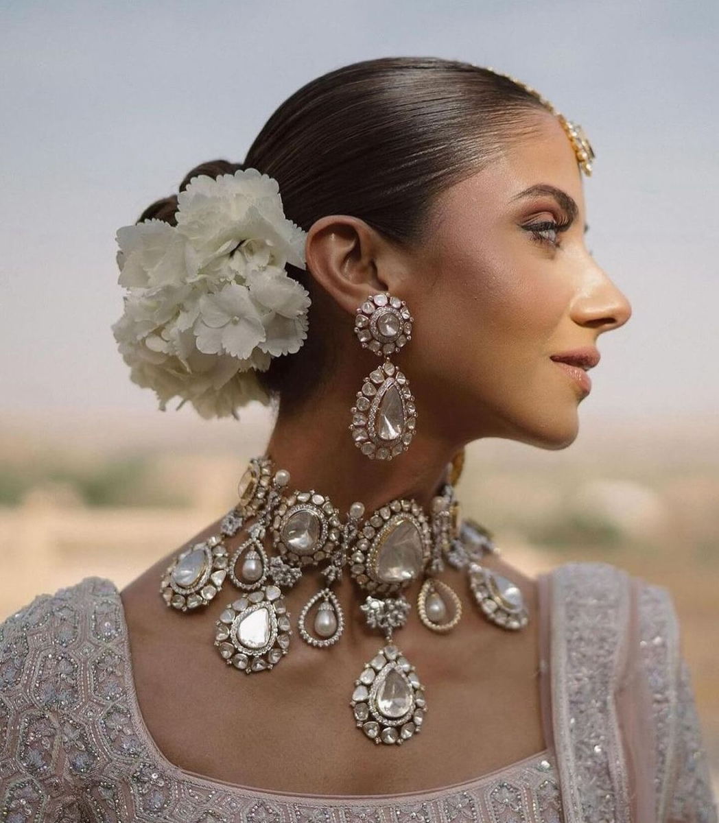 Sleek Bun With Classic White Florals for brides