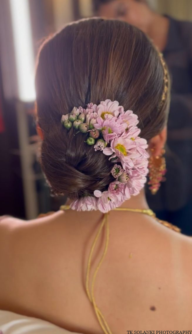 Low Buns With Floral Accents