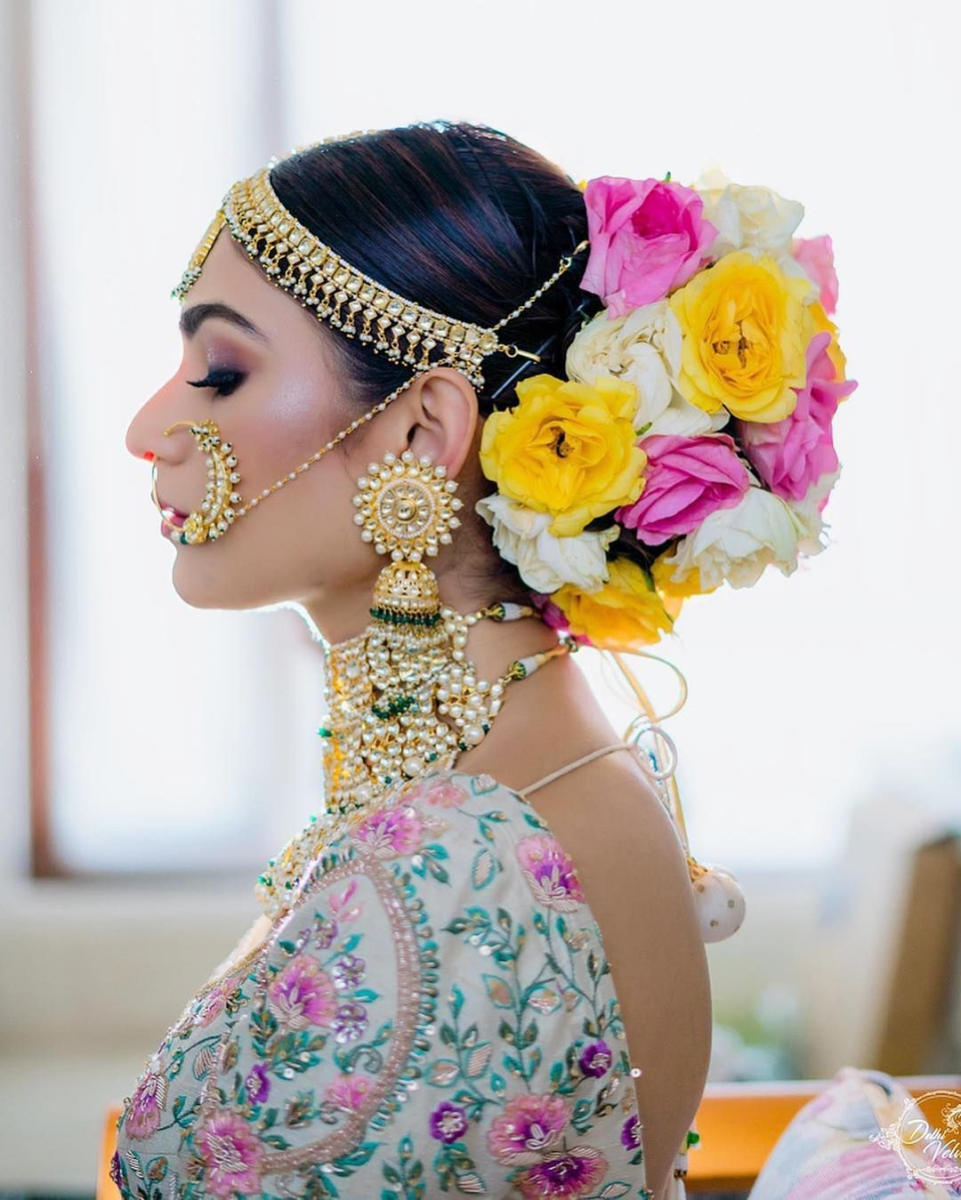 Low Buns With Floral Accents