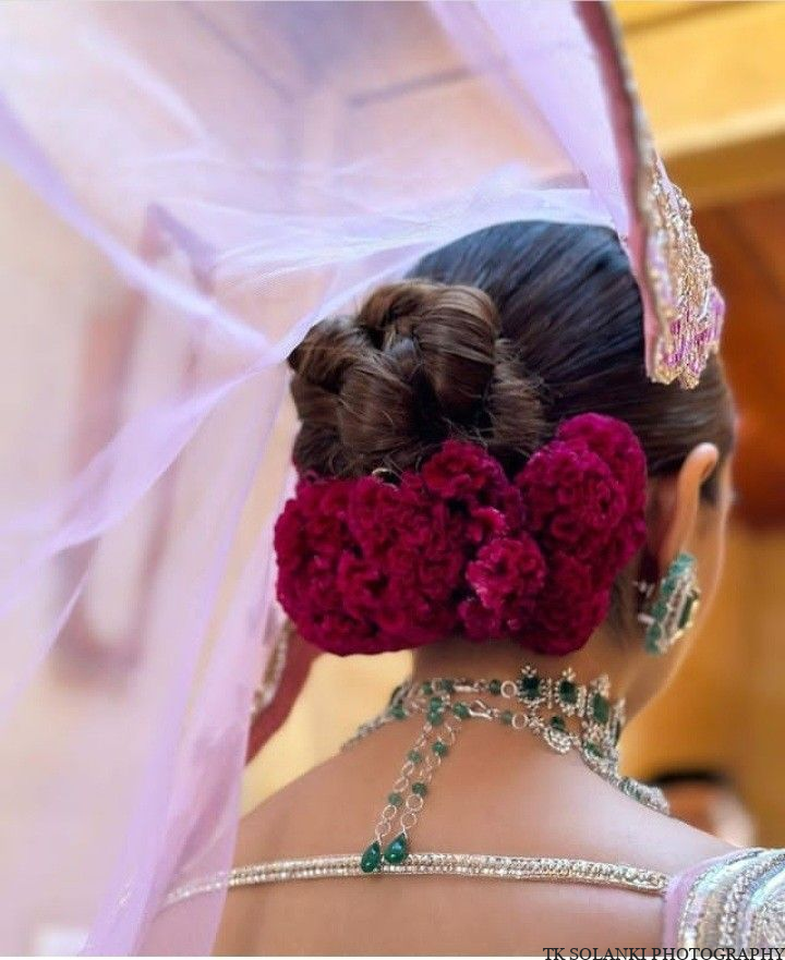 Twisted Knot Bun With Ruby Red Roses for bride